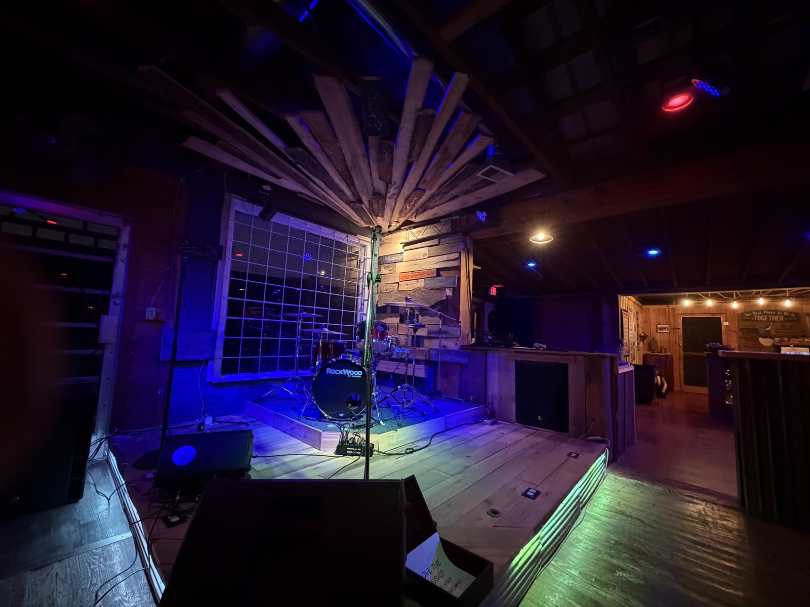 Backbeat stage with drums and colorful lighting